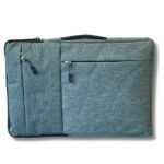 Grey fabric laptop bag featuring two front zippered compartments and a top handle, designed for secure and stylish transport of laptops and accessories.