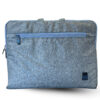 Grey fabric laptop sleeve with a horizontal zipper pocket and a Dell logo patch in the corner, designed for lightweight laptop protection and easy portability.