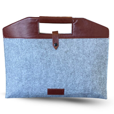Grey felt document sleeve featuring a brown leather top handle and secure buttoned strap closure, offering a sophisticated look and reliable protection for documents or laptops.
