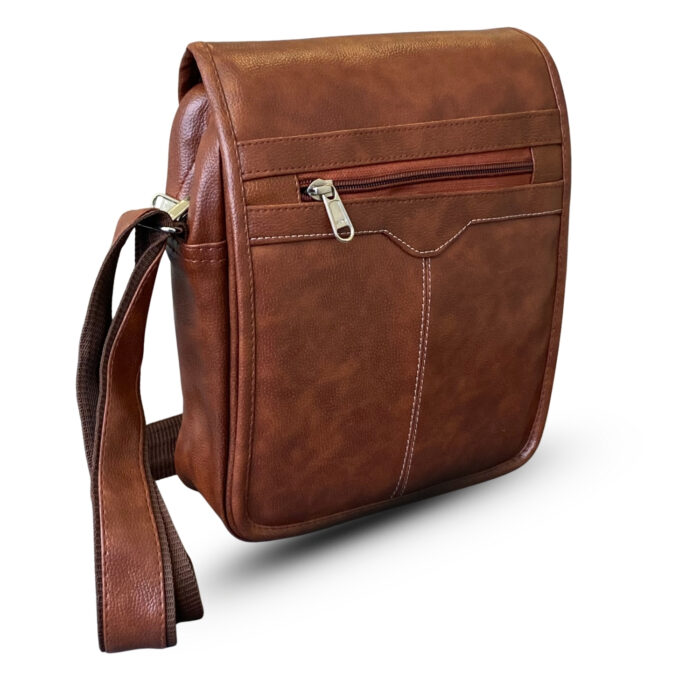 Brown faux leather vertical sling bag with a front zippered pocket and adjustable shoulder strap, featuring detailed stitching and a smooth texture.
