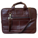 Brown leather laptop bag featuring dual top handles and a large front zippered pocket, ideal for carrying office essentials in style.